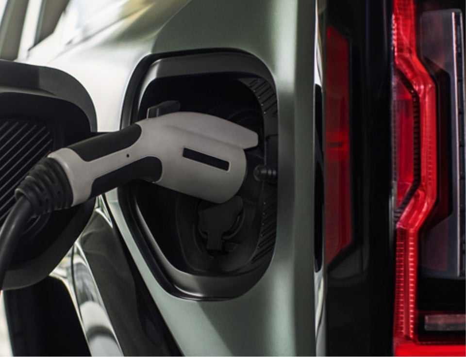 Close up of charging port with charger plugged in on a GMC Hummer EV SUV - Star GMC of Quakertown in Quakertown PA